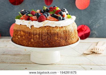 Angel food cake with whipped cream and fresh berries