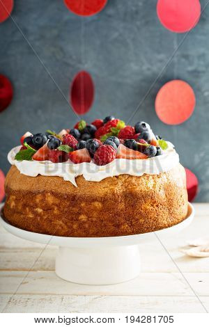 Angel food cake with whipped cream and fresh berries