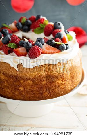 Angel food cake with whipped cream and fresh berries