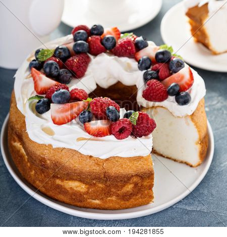 Angel food cake with whipped cream and fresh berries