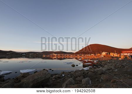 Sunset over the community of  Qikiqtarjuaq, Broughton Island, Nunavut, Canada