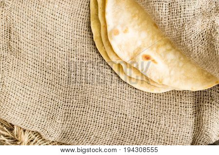 Flat Bread On A Burlap Background