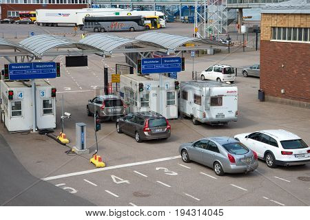 HELSINKI, FINLAND - JUNE 11, 2017: Cars in line for loading by sea ferry of the company 