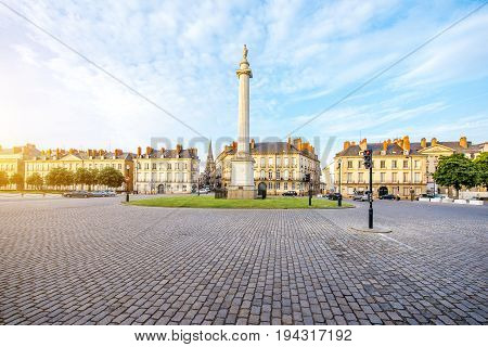 Street view on the Marechal-Foch sqaure with Louis column during the sunset in Nantes city in France
