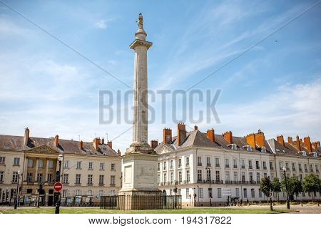 Street view on the Marechal-Foch sqaure with Louis column during the sunny morning in Nantes city in France