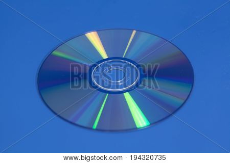 Compact Dvd Cd disk on blue background