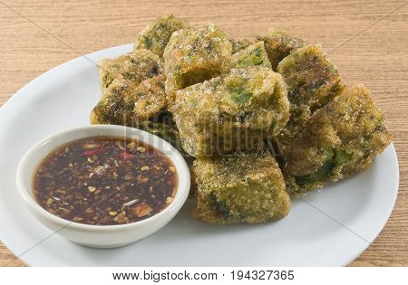 Fried Chinese Pancake or Fried Steamed Dumpling Made of Garlic Chives Rice Flour and Tapioca Flour Served with Spicy Soy Sauce. Traditional Food of China.