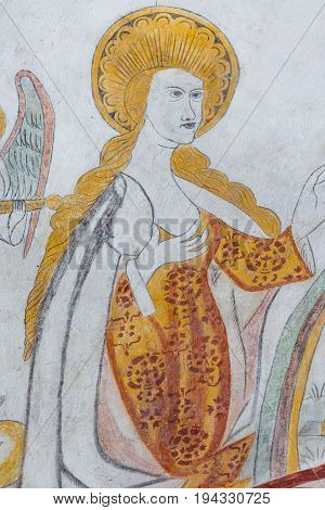 Virgin Mary standing in the kingdom of heaven a gothic fresco in Vinderslev church Denmark June 22 2017