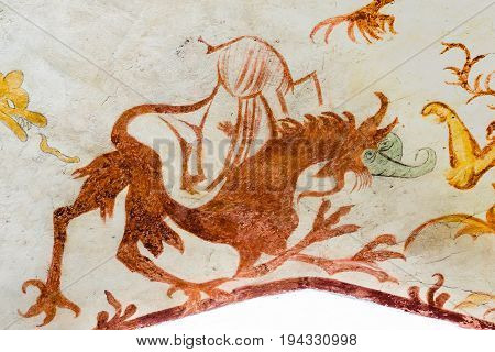 Davil as a fantasy animal a medieval gothic fresco in Vinderslev church Denmark June 22 2017