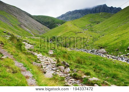 Path to Scafell Pike, view of the mountains, stream, Lake District National Park, England, selective focus