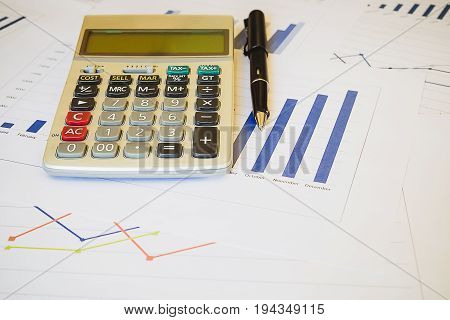 Calculator On Business Financial Report. Accounting