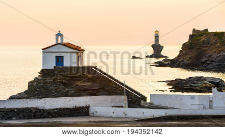 Church St. Thalassini and lighthouse, landmarks of Andros town.