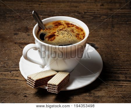 a cup of coffee and biscuits - close up