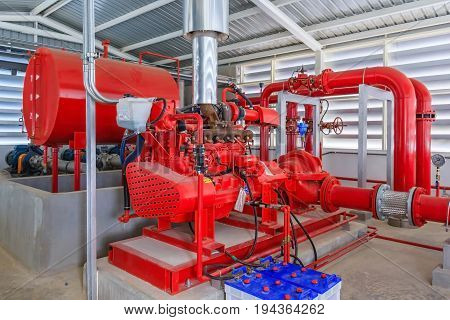 Industrial fire pump station for water sprinkler piping and fire alarm control system. Pipelines water pump valves manometers.
