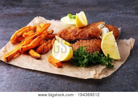 Traditional British Fish And Chips On Brown Paper
