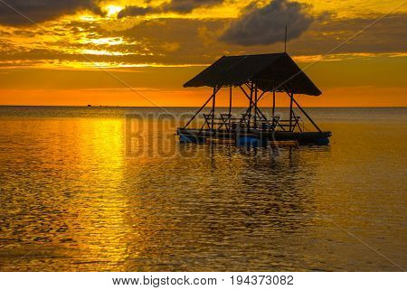 Beautiful Sunset On The Beach. Silhouettes Of Pavilions. Pandan, Panay, Philippines.