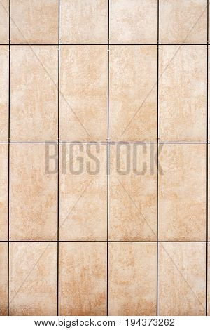 Detail of light beige tile wall texture background