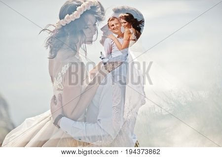 Lomographic Photo Of The Wedding Couple Hugging.