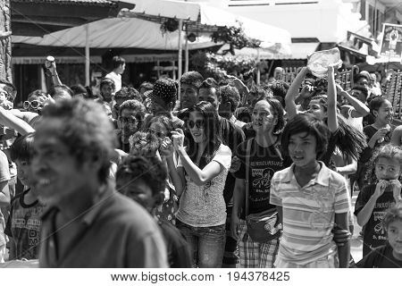 BORACAY, WESTERN VISAYAS, PHILIPPINES - JANUARY 11, 2015: Black and white picture of crowds of natives filipinos of Boracay celebrating Ati-Atihan Festival.