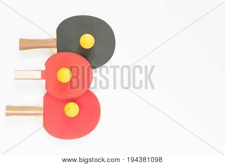 Sport background. Red and black ping-pong rackets and balls. Flat lay top view