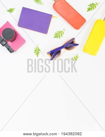 Summer background. Pink retro camera bright sunglasses ice cream. Flat lay top view.