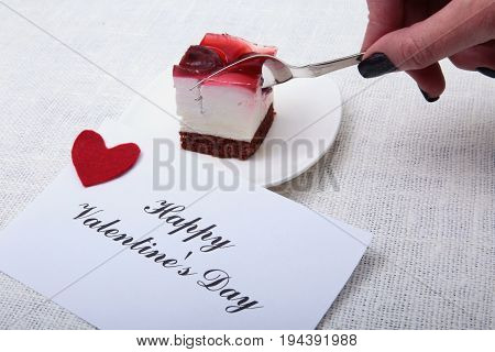 Slice of handmade cherry pie on a plate in white background.