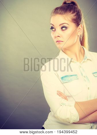 Angry Woman Looking Very Displeased Standing With Arms Folded