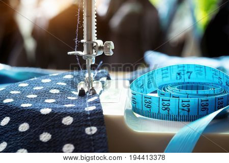 Sewing machine.sewing process in the phase of overstitching.Dressmaker work on the sewing machine.Tailor making a garment in workplace.Hobby sewing fabric as a small business concept