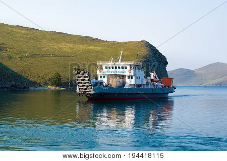 Olkhon Island, Lake Baikal, Siberia, Russia - June 24, 2017: The ferry Olkhonsky Gates carries passengers and vehicles to the Olkhon Island