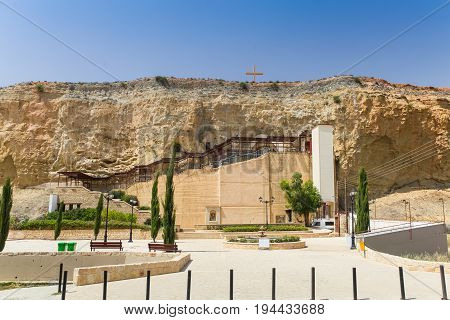 Dheftera Nicosia CYPRUS - MAY 30 2014 : View on the Panagia Chrysospiliotissa Church. The church of Panagia Chrysospiliotissa is built in the natural sandstone cave in which were formed an apse a nave narthex and vestries