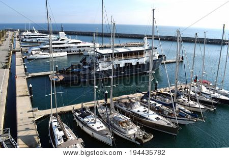 Ships yachts tied in the port of Besós's Sant Adriá
