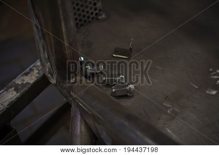 Screw nut bolt bulr on tray on buggy