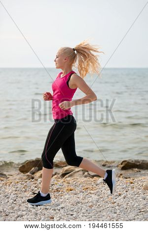 Jogging In Th Beach - Woman Runns Near Sea On Early Summer Morning