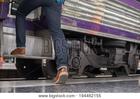 man traveler with backpacker at trainstation travel concept