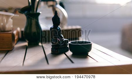 Buddha Statue At The Tea Ceremony Close-up