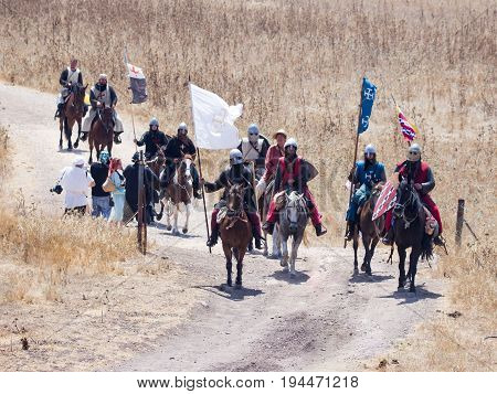 Tiberias Israel July 01 2017 : Participants in the reconstruction of Horns of Hattin battle in 1187 left the camp on horseback and ride go to the battle site near TIberias Israel