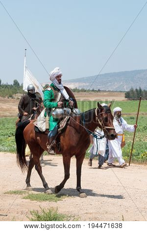 Tiberias Israel July 01 2017 : Participants in the reconstruction of Horns of Hattin battle in 1187 left the camp on horseback and go to the battle site near TIberias Israel