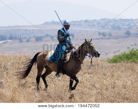 Tiberias Israel July 01 2017 : Participants in the reconstruction of Horns of Hattin battle in 1187 participate in the battle rides on the battlefield near TIberias Israel