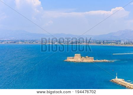 Bourtzi water fortress in Nafplio. Nafplio is a seaport town in the Peloponnese peninsula in Greece