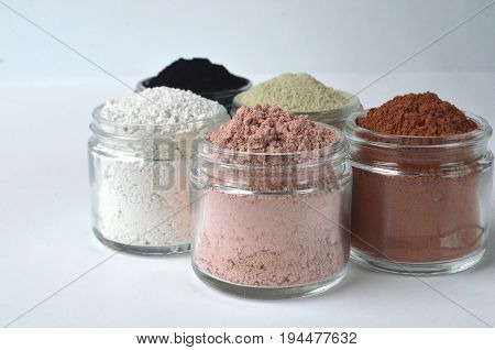 A set of four cosmetic clays for facial masks top view