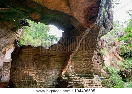 The exploitation of limestone hills canyon forming a unique architectural in Arosbaya Hill Madura Island, Indonesia
