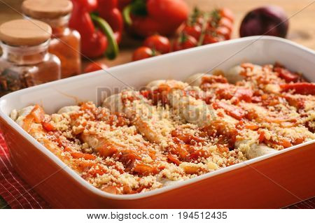 Enchiladas - mexican food, tortilla with chicken, cheese and tomatoes.
