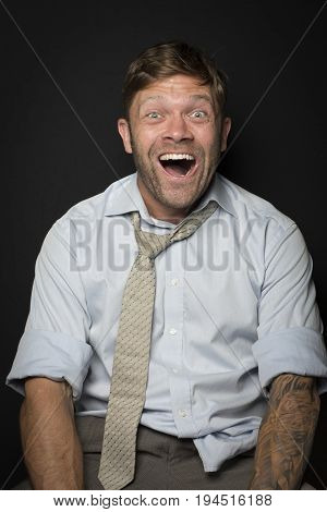 Man in a suit is very happy