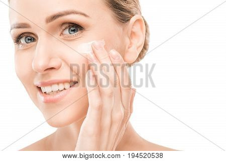 Mature female beauty health care studiio portrait cream