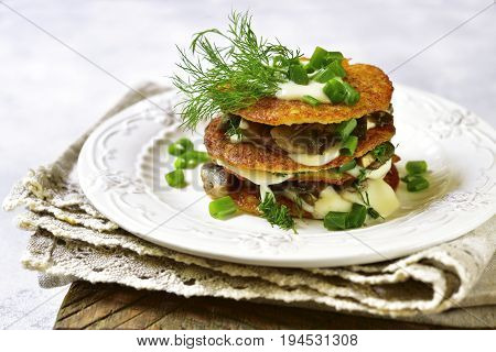 Draniki -potato Pancakes With Mushrooms And Cream Sauce.