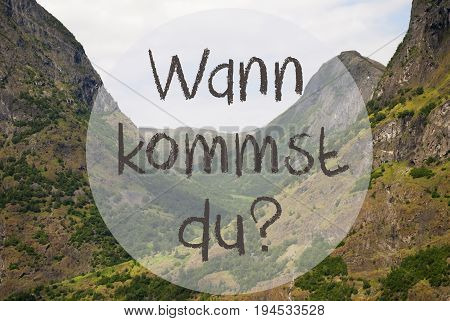 German Text Wann Kommst Du Means When Do You Come. Valley With Mountains In Norway. Peaceful Landscape, Scenery With Grass, Trees And Rocks.