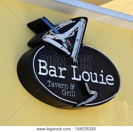 PERRYSBURG OH - JUN 25: A sign for Bar Louie in Perrysburg OH is shown here on June 25 2017. There are more than 110 locations in the United States.