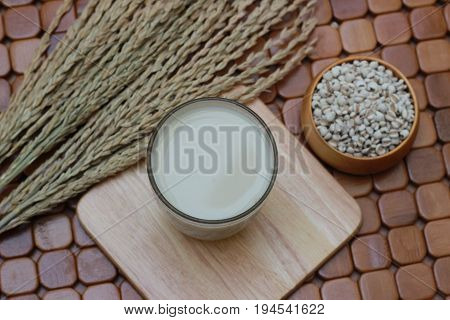 Coix lacryma-jobi, boiled in a glass on a brown background
