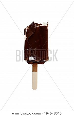 Bitten chocolate covered vanilla ice cream bar on a wooden stick isolated over a white background. Clipping path included.