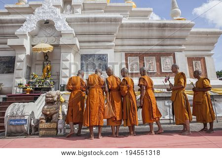 MAHASARAKHAM THAILAND - JULY82017 : thai buddha munk praying around Prathat Nadun pagoda most important buddhism place in Mahasarakham province north eastern of thailand